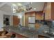 Granite countertops, wood cabinets and stainless appliances adorn this eat in kitchen at 7147 E Rancho Vista Dr # 4007, Scottsdale, AZ 85251
