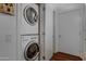 Laundry room with stacked washer and dryer units, offering convenience and space-saving design at 7147 E Rancho Vista Dr # 4007, Scottsdale, AZ 85251