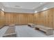 Well-maintained locker room with rows of wooden lockers and comfortable benches at 7147 E Rancho Vista Dr # 4007, Scottsdale, AZ 85251