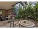 Cozy patio area with comfortable seating, lush greenery, and a hanging chair for relaxation and outdoor enjoyment at 7147 E Rancho Vista Dr # 4007, Scottsdale, AZ 85251
