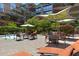 Lounging and dining options surround the community pool at this lush luxury condominium property at 7147 E Rancho Vista Dr # 4007, Scottsdale, AZ 85251