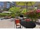 Outdoor dining area with built in grill near the community pool at this luxury condominium property at 7147 E Rancho Vista Dr # 4007, Scottsdale, AZ 85251