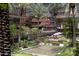 Beautiful view of tranquil water feature, putting green, landscaping and multi-story condos and palm trees at 7147 E Rancho Vista Dr # 4007, Scottsdale, AZ 85251