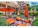 Beautiful courtyard with orange couches, tables, umbrellas, and water feature for relaxing at 7157 E Rancho Vista Dr # 6011, Scottsdale, AZ 85251