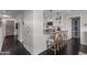 Modern kitchen boasts sleek white cabinetry, a breakfast bar with seating, and stainless steel appliances at 7157 E Rancho Vista Dr # 6011, Scottsdale, AZ 85251