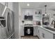 The updated kitchen features stainless steel appliances, white cabinets, and modern fixtures at 7157 E Rancho Vista Dr # 6011, Scottsdale, AZ 85251