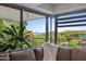 A spacious living area features comfortable seating and expansive windows with scenic outdoor views at 7157 E Rancho Vista Dr # 6011, Scottsdale, AZ 85251