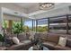 Sunlit living room featuring large windows with lush views and a spacious sectional sofa at 7157 E Rancho Vista Dr # 6011, Scottsdale, AZ 85251