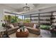 Bright living room with floor-to-ceiling windows and a comfortable sectional sofa at 7157 E Rancho Vista Dr # 6011, Scottsdale, AZ 85251