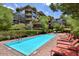 Outdoor swimming pool with lounge chairs, mature trees and landscaping near upscale condo at 7157 E Rancho Vista Dr # 6011, Scottsdale, AZ 85251