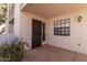 Exterior view of the front entrance featuring a security door and large window at 7800 E Lincoln Dr # 1100, Scottsdale, AZ 85250