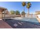 Backyard with covered pool, fire pit, pergola, and desert landscaping at 7830 S 26Th St, Phoenix, AZ 85042