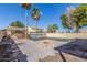 The backyard features a pool, firepit, pergola, and desert landscaping at 7830 S 26Th St, Phoenix, AZ 85042