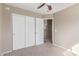Bedroom with sliding door closet, neutral carpet and access to an adjacent room at 7830 S 26Th St, Phoenix, AZ 85042