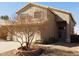 A well-maintained home exterior featuring neutral stucco, a tile roof, and desert landscaping at 7830 S 26Th St, Phoenix, AZ 85042
