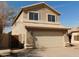 A two-story home with a neutral-colored facade and a two-car garage with tiled roof at 7830 S 26Th St, Phoenix, AZ 85042