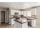 Clean kitchen featuring white cabinets, a tile backsplash, and stainless steel appliances at 7830 S 26Th St, Phoenix, AZ 85042