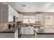 Kitchen with white cabinets, a tile backsplash, and stainless steel appliances at 7830 S 26Th St, Phoenix, AZ 85042