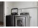 The laundry room features a modern washer and dryer set with lots of natural light at 7830 S 26Th St, Phoenix, AZ 85042