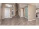 Spacious living area with tile floors, a staircase, and a view into the adjacent kitchen at 7830 S 26Th St, Phoenix, AZ 85042