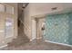 Bright living area featuring tile flooring, staircase, and an open view to the kitchen at 7830 S 26Th St, Phoenix, AZ 85042