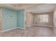 Open-concept living room featuring tile flooring, neutral walls, and ample natural light at 7830 S 26Th St, Phoenix, AZ 85042