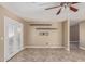 Living room with tile floors, ceiling fan, and access to the backyard through glass doors at 7830 S 26Th St, Phoenix, AZ 85042