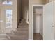 Carpeted staircase with natural light and a view into a closet and to the second story at 7830 S 26Th St, Phoenix, AZ 85042
