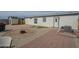 View of a large, flat backyard with a firepit and some landscaping at 9709 E Empress Ave, Mesa, AZ 85208