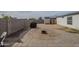 This backyard is highlighted by a firepit and a grill, perfect for outdoor gatherings at 9709 E Empress Ave, Mesa, AZ 85208