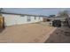 A view of a large backyard, with a firepit, and a covered grill at 9709 E Empress Ave, Mesa, AZ 85208