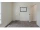 A bedroom with a door and a white board provides a clean and simple space at 9709 E Empress Ave, Mesa, AZ 85208