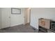 An empty bedroom with neutral walls and carpet presents a blank canvas for customization at 9709 E Empress Ave, Mesa, AZ 85208