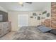 Cozy bedroom features carpet, grey dresser and window for natural light at 9709 E Empress Ave, Mesa, AZ 85208