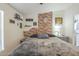 Comfortable bedroom with decor, carpet, and an ensuite bathroom at 9709 E Empress Ave, Mesa, AZ 85208
