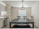 Inviting dining room with modern light fixture, neutral paint, and breakfast bar at 9709 E Empress Ave, Mesa, AZ 85208