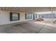 Street view of home showing the low maintenance front yard and the covered parking at 9709 E Empress Ave, Mesa, AZ 85208