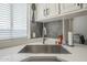 Deep stainless steel kitchen sink with modern faucet and quartz countertops at 9709 E Empress Ave, Mesa, AZ 85208