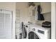 Functional laundry room featuring modern washer and dryer, neutral paint, and built-in storage at 9709 E Empress Ave, Mesa, AZ 85208
