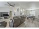 Open-concept living room flowing into dining and kitchen areas featuring durable vinyl floors at 9709 E Empress Ave, Mesa, AZ 85208
