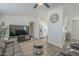 Comfortable living room flowing into kitchen and dining areas featuring modern ceiling fan at 9709 E Empress Ave, Mesa, AZ 85208