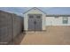 Storage shed features double doors and is located in the back yard at 9709 E Empress Ave, Mesa, AZ 85208