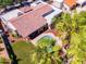 Aerial view of a private backyard, lush landscaping, pool, patio, and tile roof at 9740 E Gold Dust Ave, Scottsdale, AZ 85258