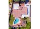 Backyard aerial view featuring a swimming pool, pergola, green grass, and privacy landscaping at 9740 E Gold Dust Ave, Scottsdale, AZ 85258
