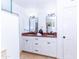 Bright bathroom features dual sinks, granite countertops, and white cabinetry for a clean, modern aesthetic at 9740 E Gold Dust Ave, Scottsdale, AZ 85258