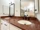 Bathroom vanity with double sinks, granite countertops, and modern fixtures at 9740 E Gold Dust Ave, Scottsdale, AZ 85258
