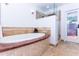 Bright bathroom features a soaking tub with tile surround and a glass-enclosed shower; access to outdoors at 9740 E Gold Dust Ave, Scottsdale, AZ 85258