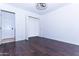 Clean bedroom with hard wood floors and modern fan at 9740 E Gold Dust Ave, Scottsdale, AZ 85258