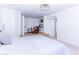 View of the bedroom, showing a seating area and travertine tile floors at 9740 E Gold Dust Ave, Scottsdale, AZ 85258