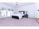 Bright bedroom boasts a bed, ceiling fan, and access to the backyard at 9740 E Gold Dust Ave, Scottsdale, AZ 85258